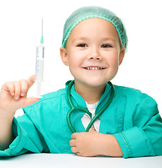 Image showing Little girl is playing doctor with syringe