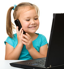 Image showing Little girl with laptop