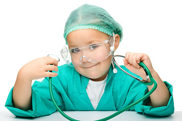 Image showing Little girl is playing doctor with stethoscope