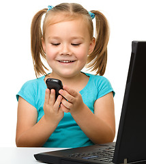 Image showing Little girl with laptop