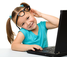 Image showing Little girl with laptop