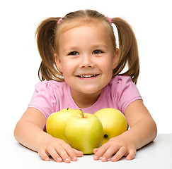 Image showing Little girl with apples