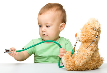 Image showing Little boy is playing doctor with stethoscope