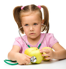 Image showing Little girl with apples