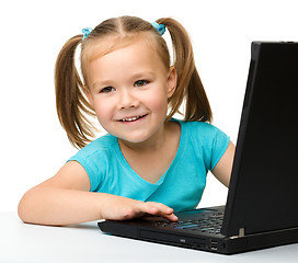 Image showing Little girl with laptop