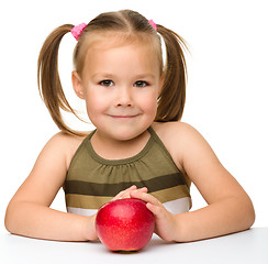 Image showing Little girl with red apple