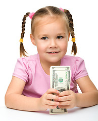 Image showing Cute little girl with paper money - dollars