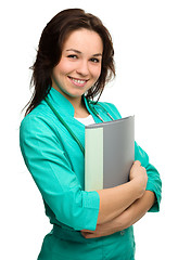 Image showing Young attractive woman wearing a doctor uniform