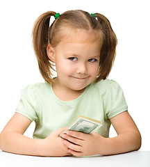 Image showing Cute little girl with paper money - dollars