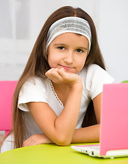 Image showing Little girl with laptop