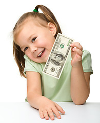 Image showing Cute little girl with paper money - dollars