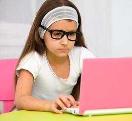 Image showing Little girl with laptop