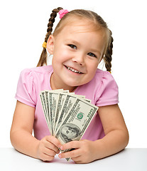 Image showing Cute little girl with paper money - dollars