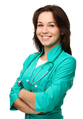 Image showing Young attractive woman wearing a doctor uniform