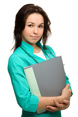 Image showing Young attractive woman wearing a doctor uniform