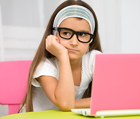 Image showing Little girl with laptop