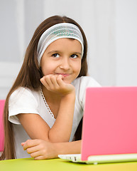 Image showing Little girl with laptop