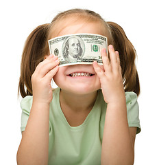 Image showing Cute little girl with paper money - dollars