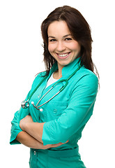 Image showing Young attractive woman wearing a doctor uniform