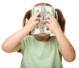 Image showing Cute little girl with paper money - dollars