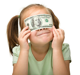 Image showing Cute little girl with paper money - dollars