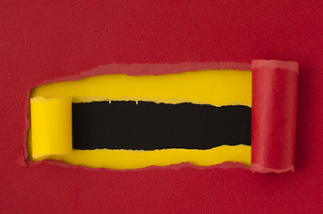 Image showing Red torn paper with black space for text