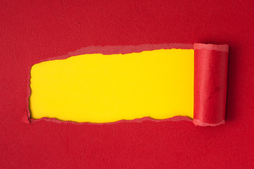 Image showing Red torn paper with yellow space for text 