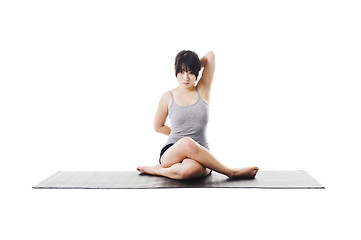 Image showing Chinese woman doing yoga.