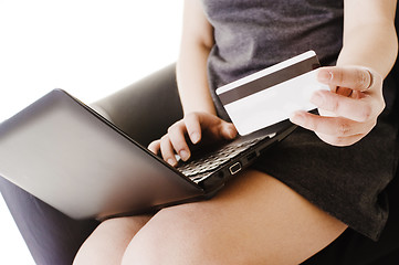 Image showing Chinese woman shopping online with a credit card.