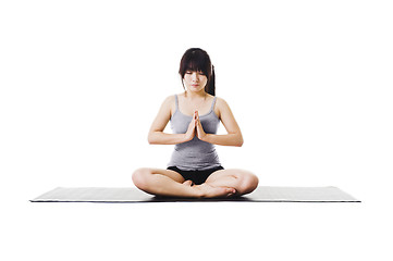 Image showing Chinese woman doing yoga.