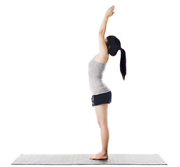 Image showing Chinese woman doing yoga.