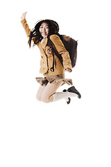 Image showing Chinese school girl jumping in the air.