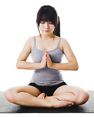 Image showing Chinese woman doing yoga.