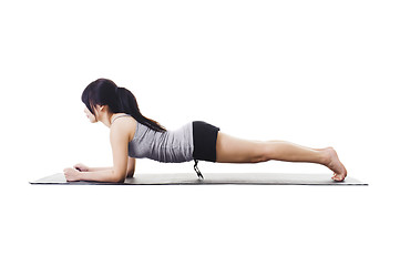 Image showing Chinese woman doing yoga.