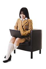 Image showing Chinese school girl working on a laptop.