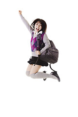 Image showing Chinese school girl jumping into air.