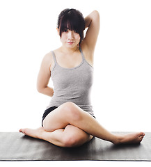 Image showing Chinese woman doing yoga.