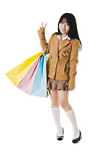 Image showing Chinese school girl shopping.