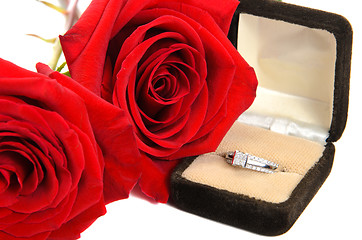 Image showing Diamond Ring Next to Two Red Roses