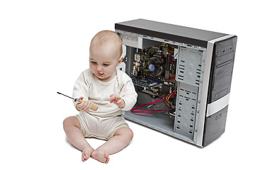 Image showing young child working on open computer