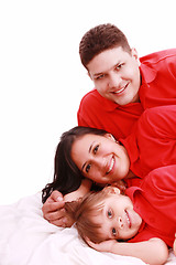 Image showing A family portrait of mom, dad and their daughter; isolated on th