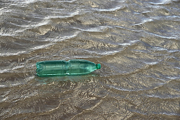 Image showing floating green bottle