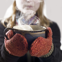 Image showing woman and hot steaming cup