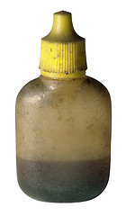 Image showing dirty old oil bottle with yellow cap