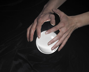 Image showing crystal ball and hands around