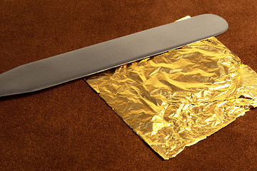 Image showing gold leaf and blade