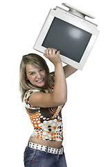 Image showing girl throwing a computer monitor