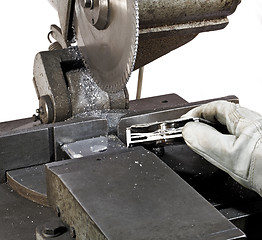 Image showing halved hdd and circular saw