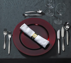 Image showing noble place setting on dark tablecloth