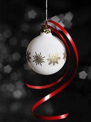 Image showing white Christmas bauble in dark back